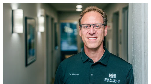 Matthew Kirkham Stands in the Hallway of Back To Healthcare Chiropractic