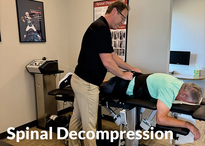 Matthew Kirkham Performing Spinal Decompression on a Male Patient Face Down